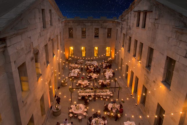 Outdoor event venue in The Commons SF with elegant tables and string lights, perfect for weddings.