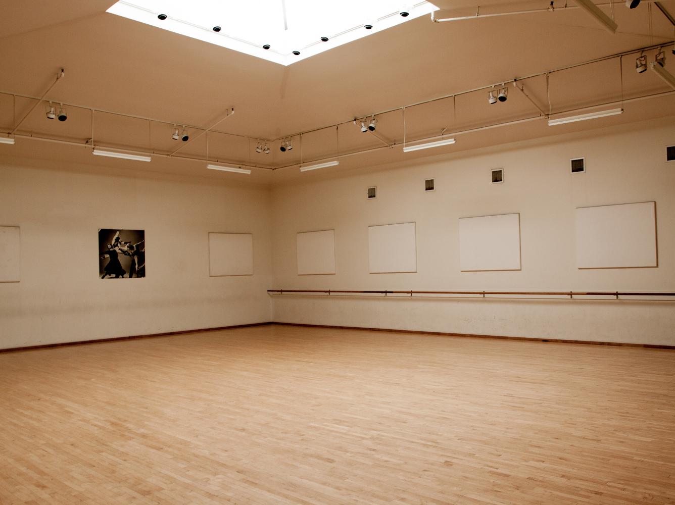 Spacious Chris Hellman Studio with polished wood floor, ideal for workshops and dance classes.