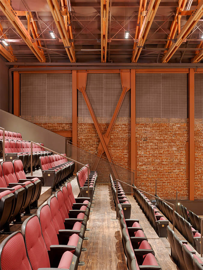 Modern ODC Theater lobby with tiered seating, ideal for conferences and presentations.
