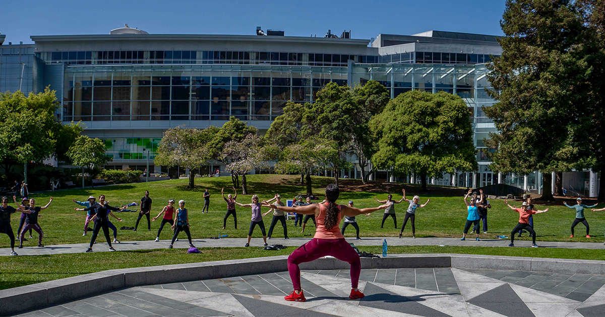 Outdoor fitness class at Yerba Buena Gardens for team-building and wellness events.