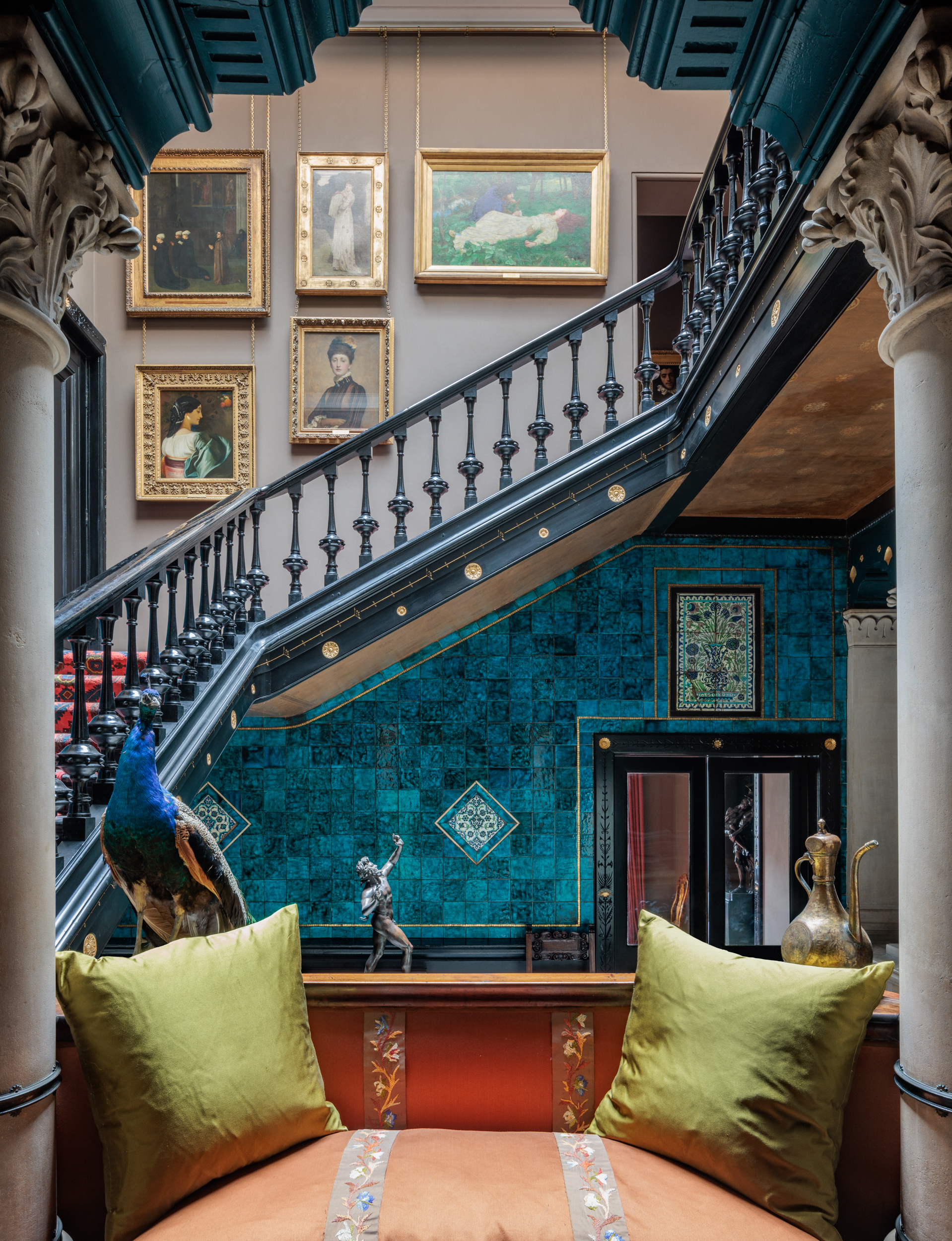 Corporate reception space with grand staircase and turquoise walls, perfect for upscale events.