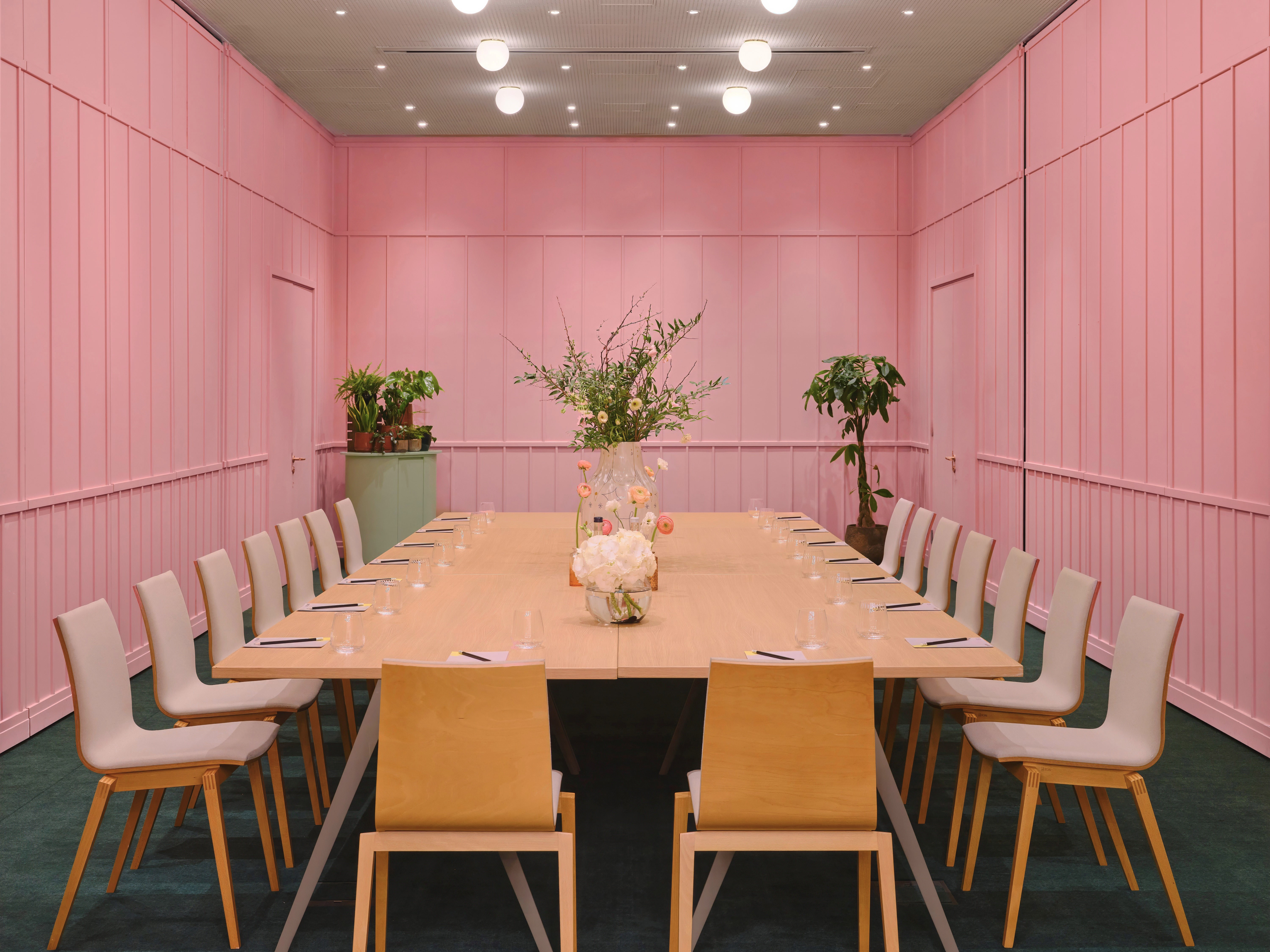 Stylish meeting room with pink walls for creative gatherings at art'otel London Battersea.