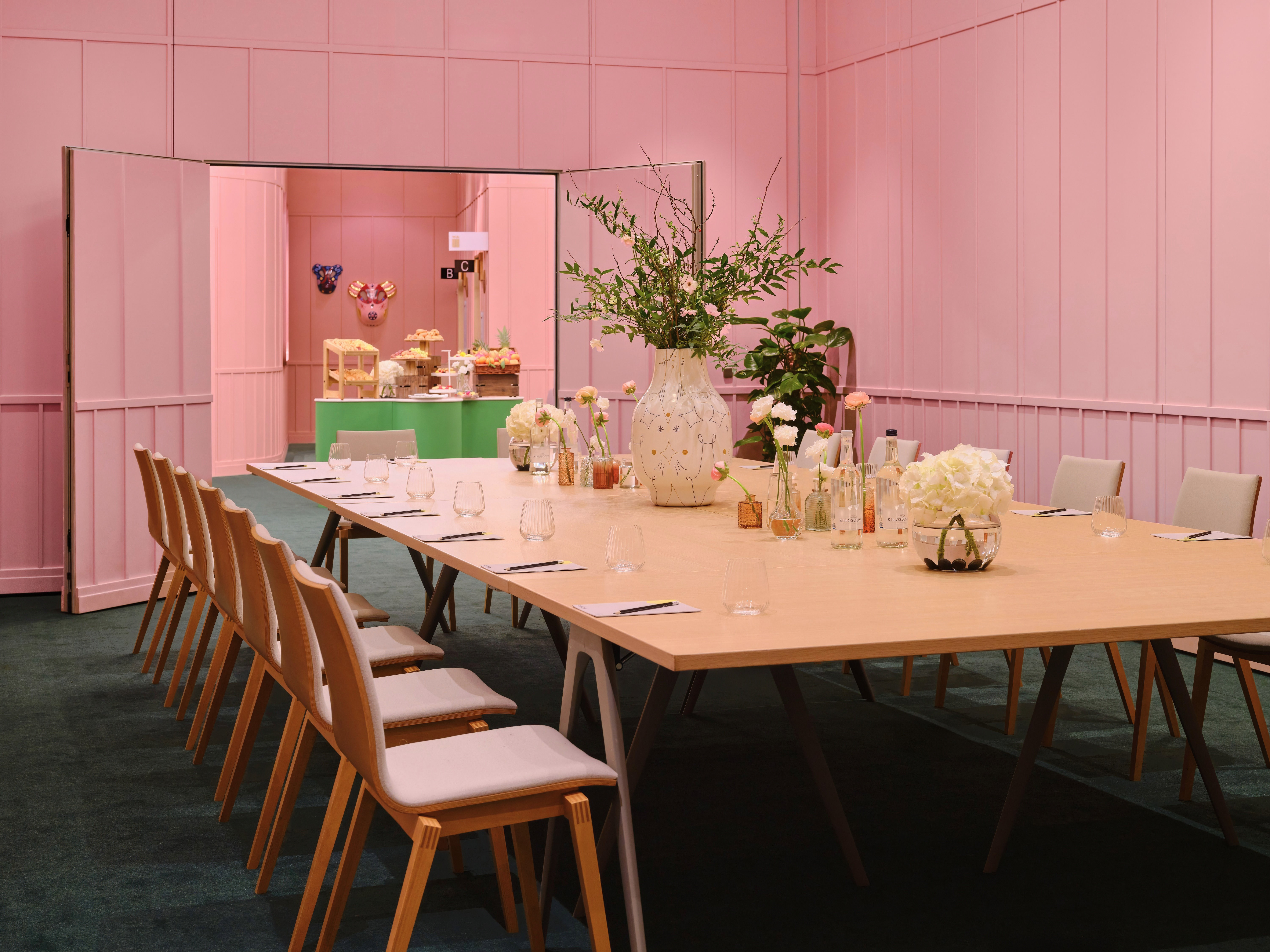 Stylish meeting room with pink walls, perfect for workshops at art'otel London Battersea.