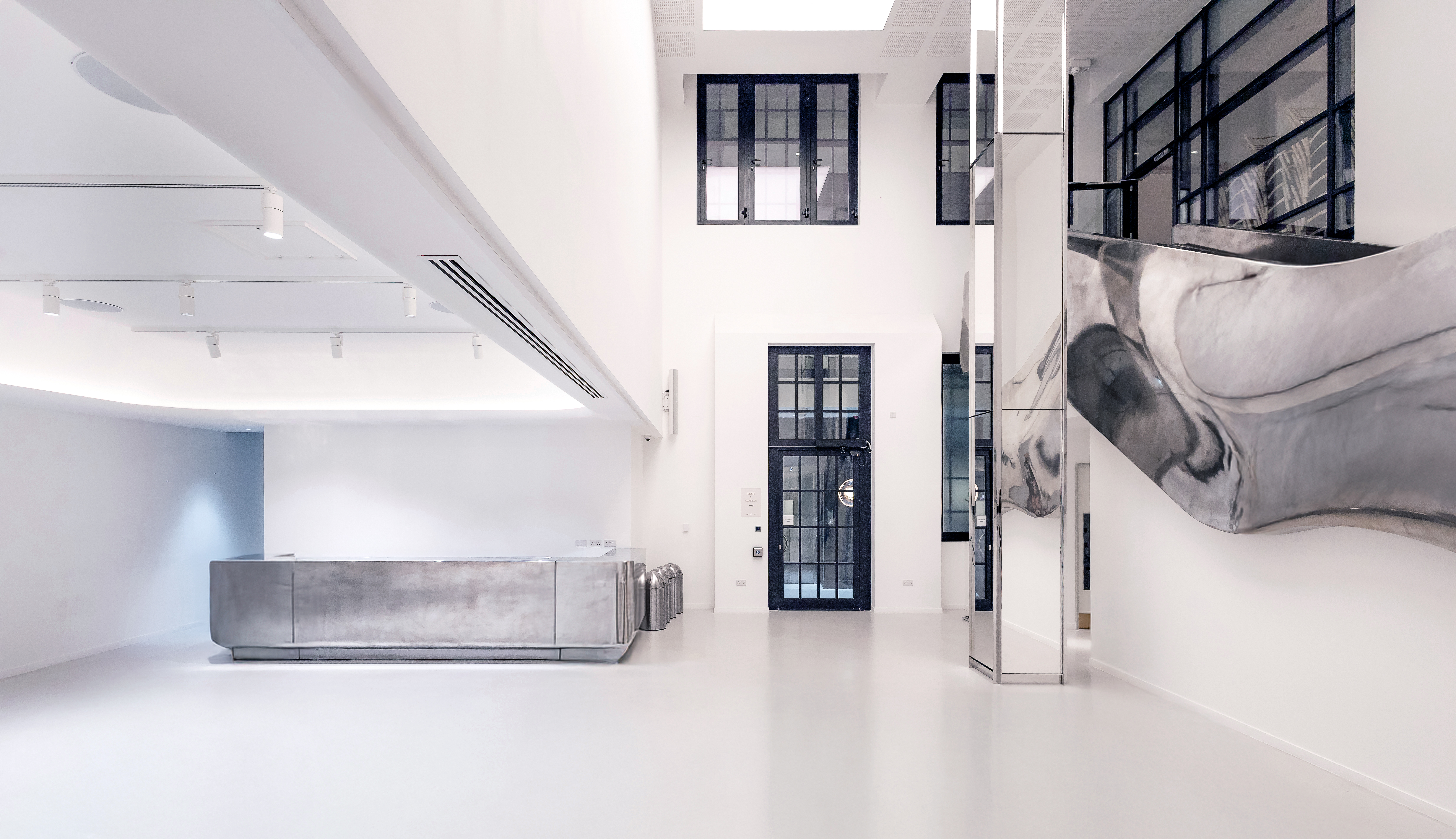 Modern event space, concrete desk, corporate events, modern party