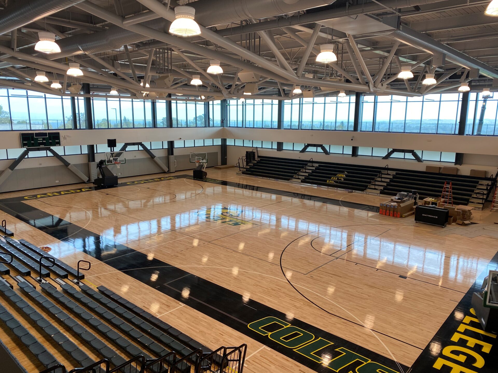 Spacious indoor gym with hardwood floor at College of San Mateo for events and sports.