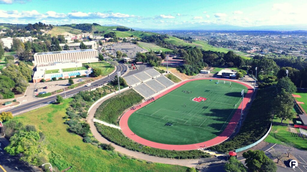 Athletic field at CSUEB Pioneer Stadium, ideal for events with scenic hills backdrop.