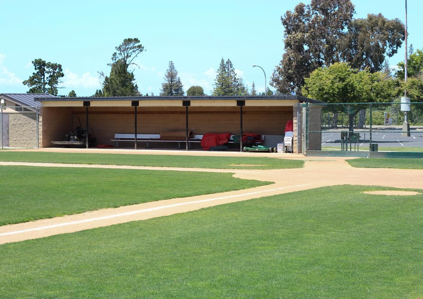 Athletic field dugout at CSUEB Pioneer Stadium for team-building events and sports clinics.