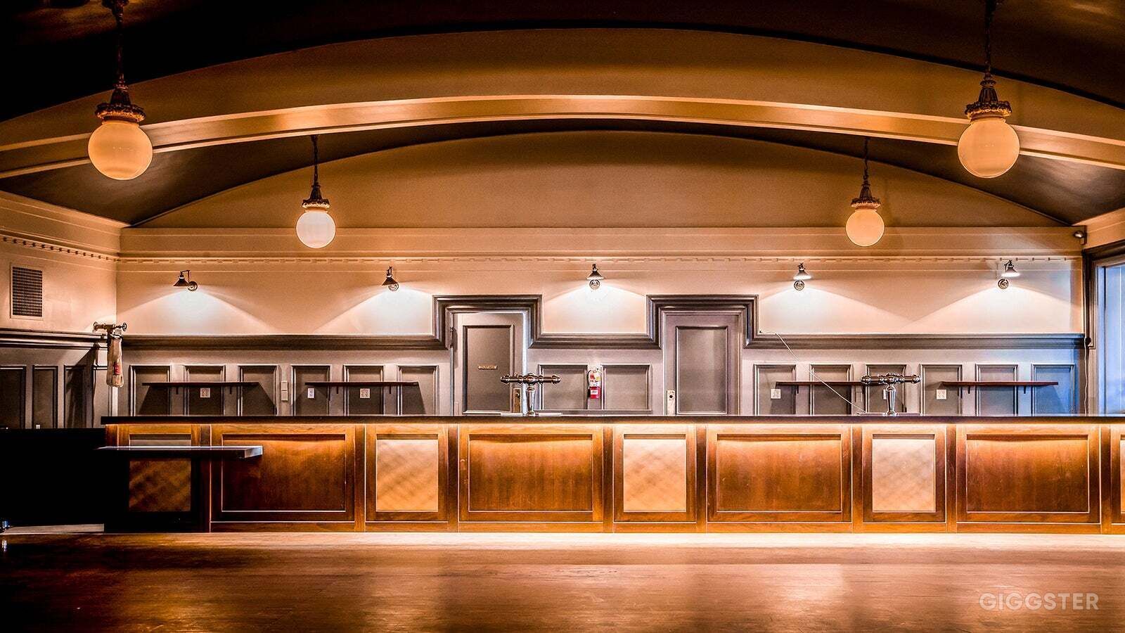 Sophisticated event space with polished bar, ideal for cocktail receptions and gatherings.