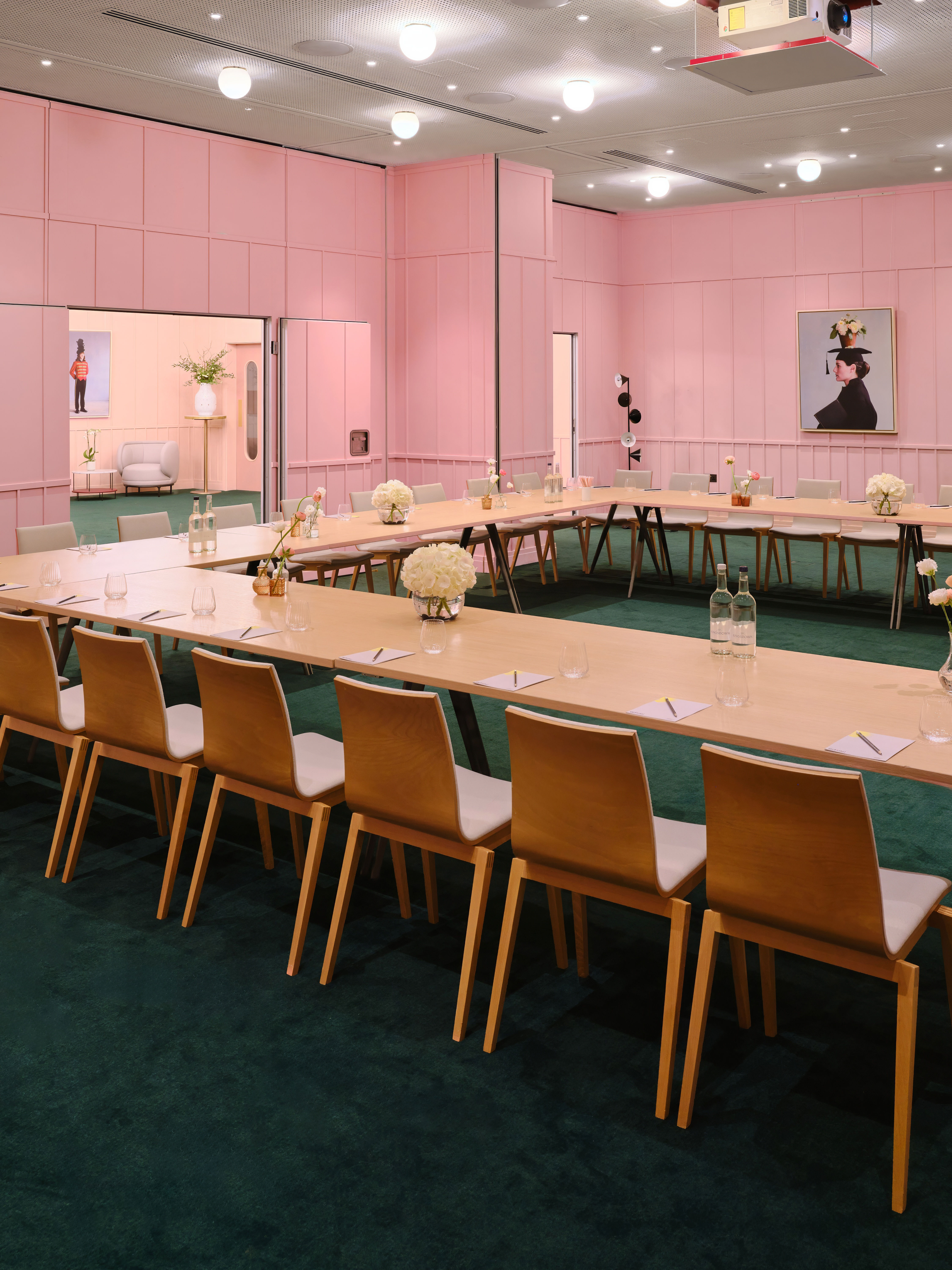 Creative Room 1-3 at art'otel London, featuring pink walls and a large meeting table.