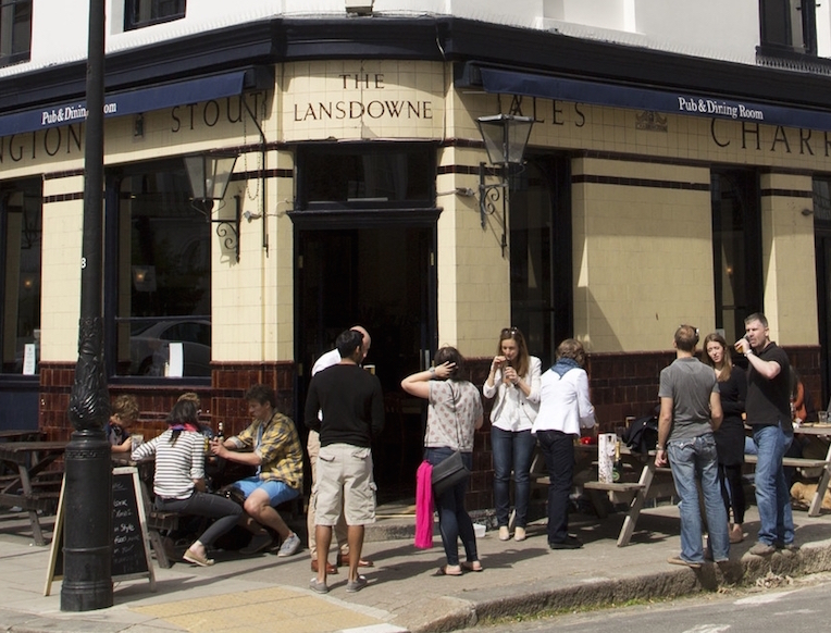Vibrant outdoor pub bar scene for casual networking and social events.