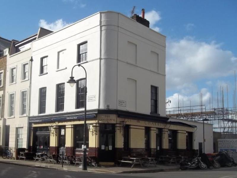 Charming Lansdowne Pub bar with outdoor seating, ideal for networking events.