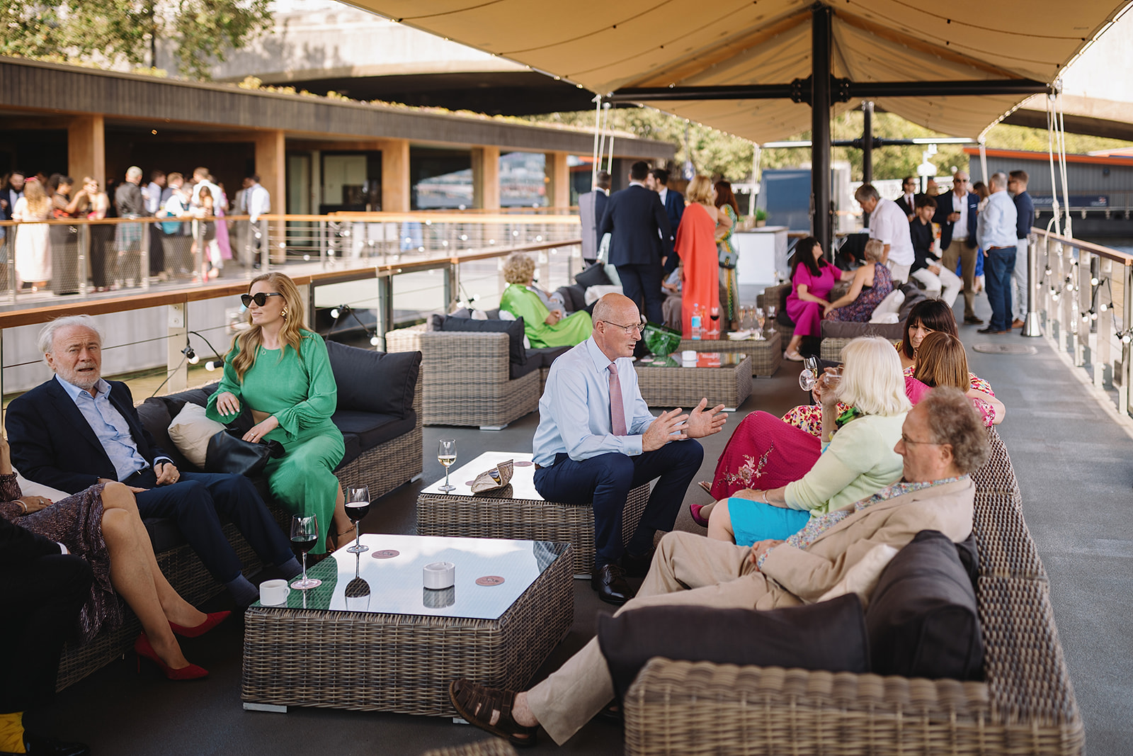 Outdoor networking event for 900 guests with stylish lounge furniture and elegant decor.