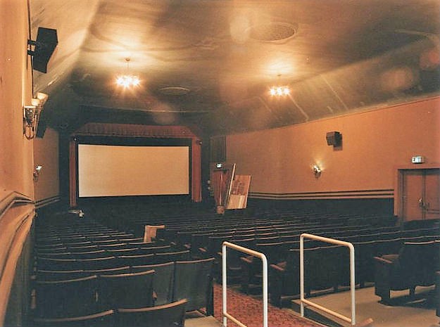 Classic auditorium with vintage decor, ideal for presentations and film screenings.