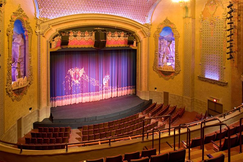 Elegant auditorium in Vogue Theater with tiered seating for events and performances.