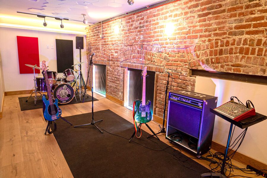Rehearsal Studio with brick wall, perfect for music events and band rehearsals.