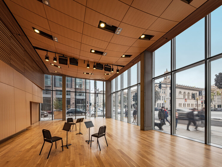 Modern event space with large windows, ideal for music rehearsals and performances.