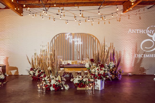 Elegant cocktail room with floral decor, perfect for weddings and upscale events.
