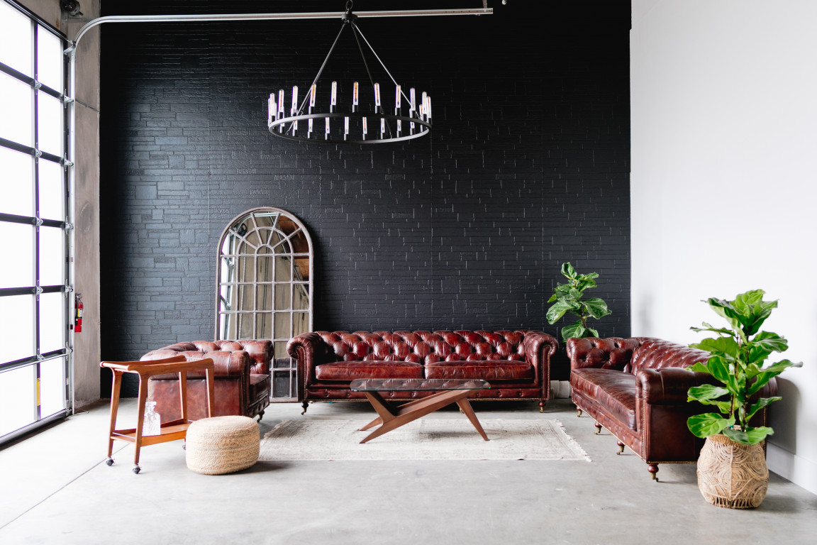 Stylish lounge with leather sofas for networking events at BLOC VENUE.