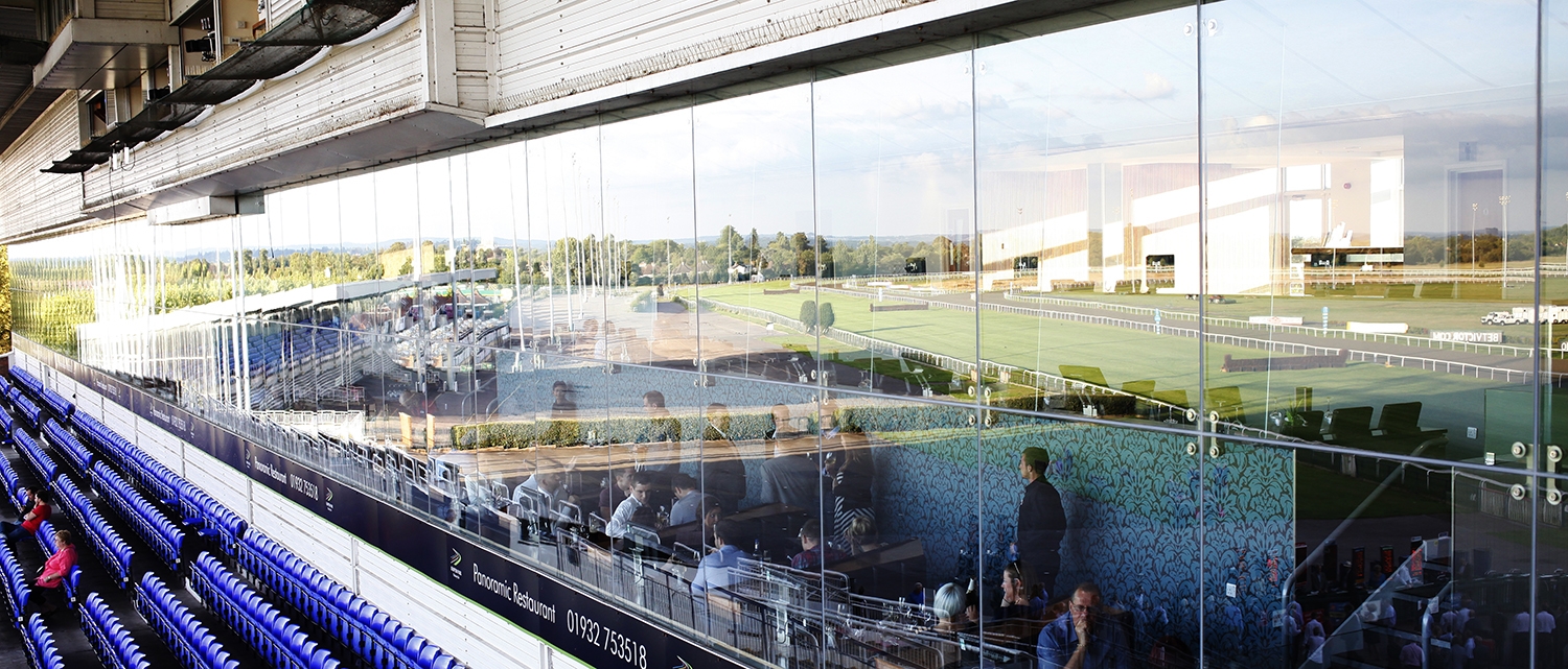 Modern event space at Kempton Park Racecourse with large glass windows for corporate meetings.