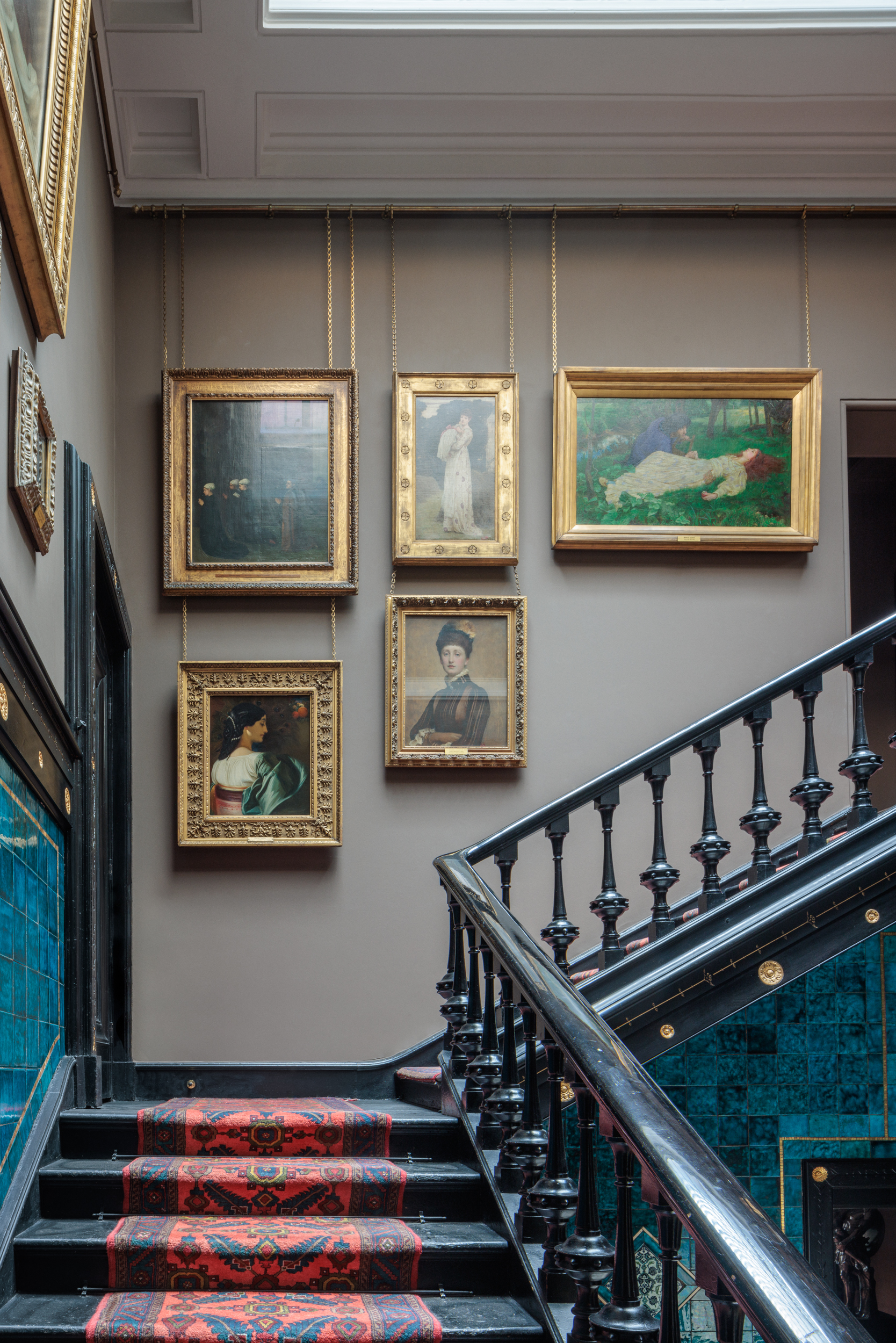 Elegant Christmas party space with art gallery wall at Leighton House.
