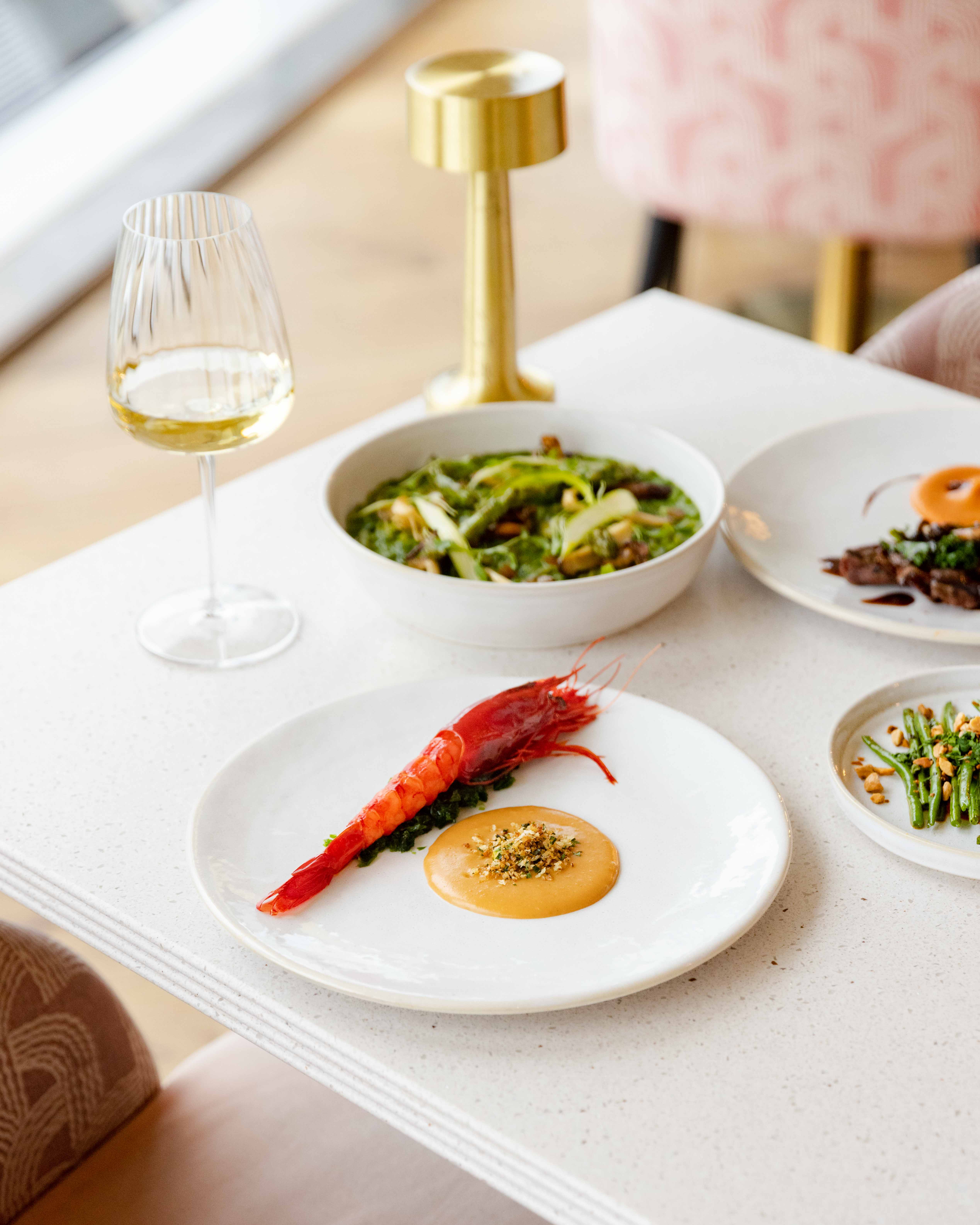 Elegant dining setup at JOIA Restaurant, shrimp centerpiece, upscale event in London.