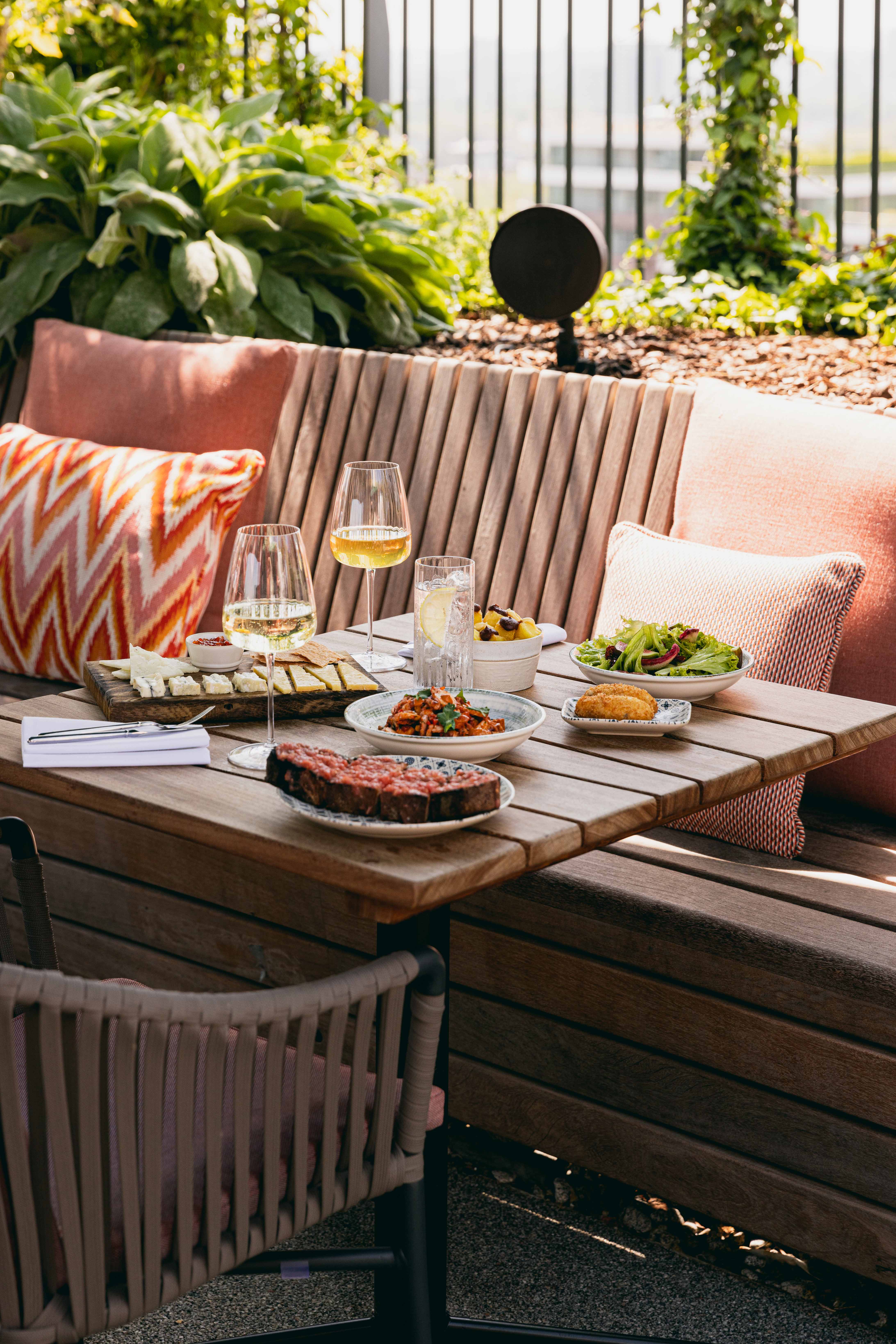 Elegant dining setup at JOIA Rooftop, ideal for corporate retreats and networking events.