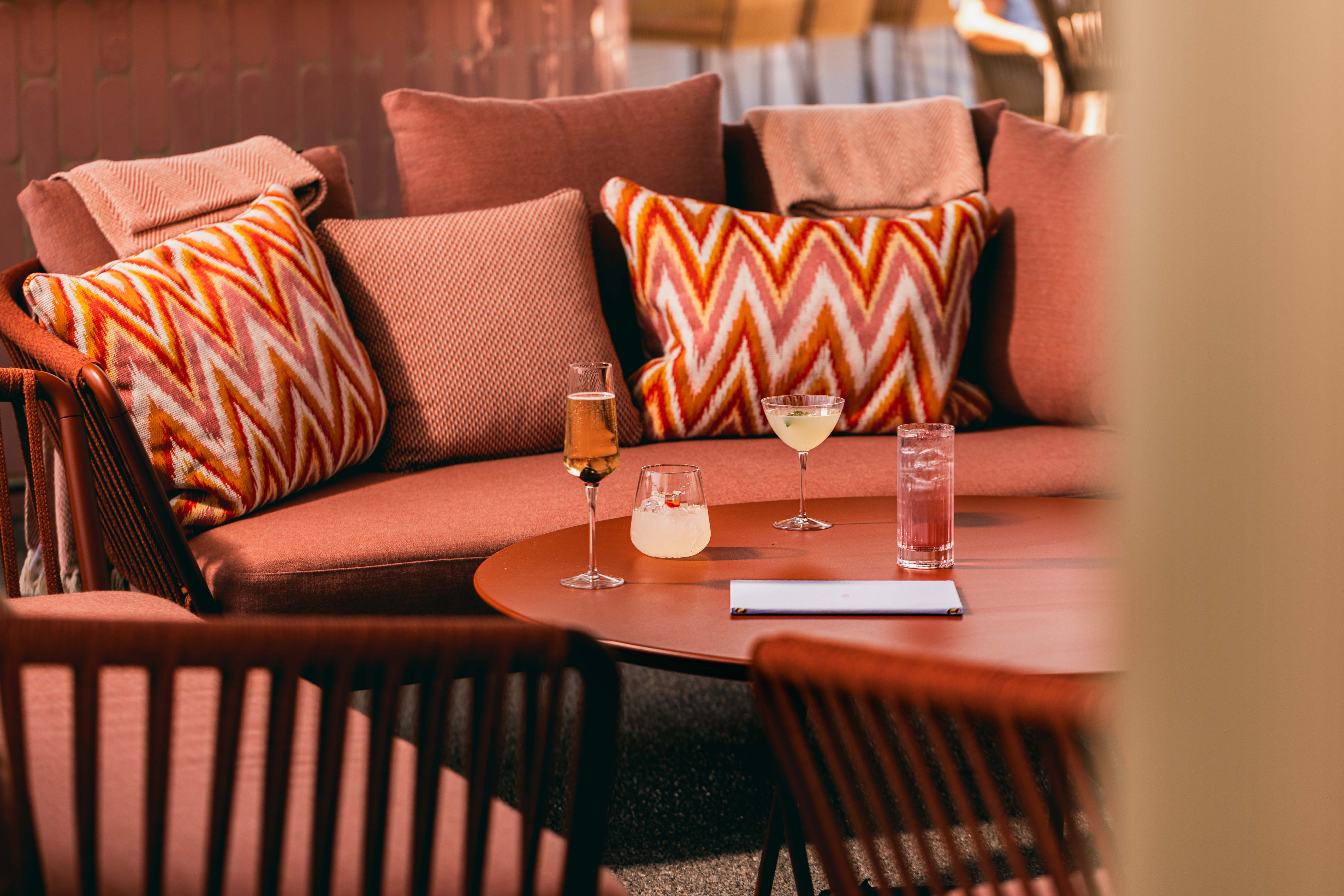 Stylish outdoor seating at JOIA Rooftop, perfect for networking events in London.