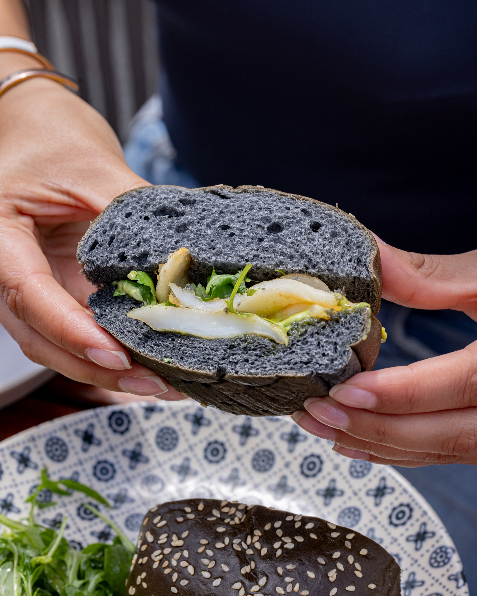 Black bun sandwich at JOIA Rooftop, art'otel London, ideal for themed events.