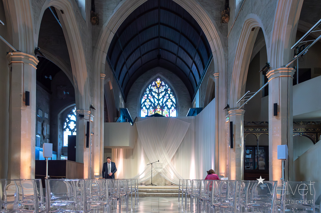 Elegant wedding venue in Garden Museum with high vaulted ceilings and soft lighting.