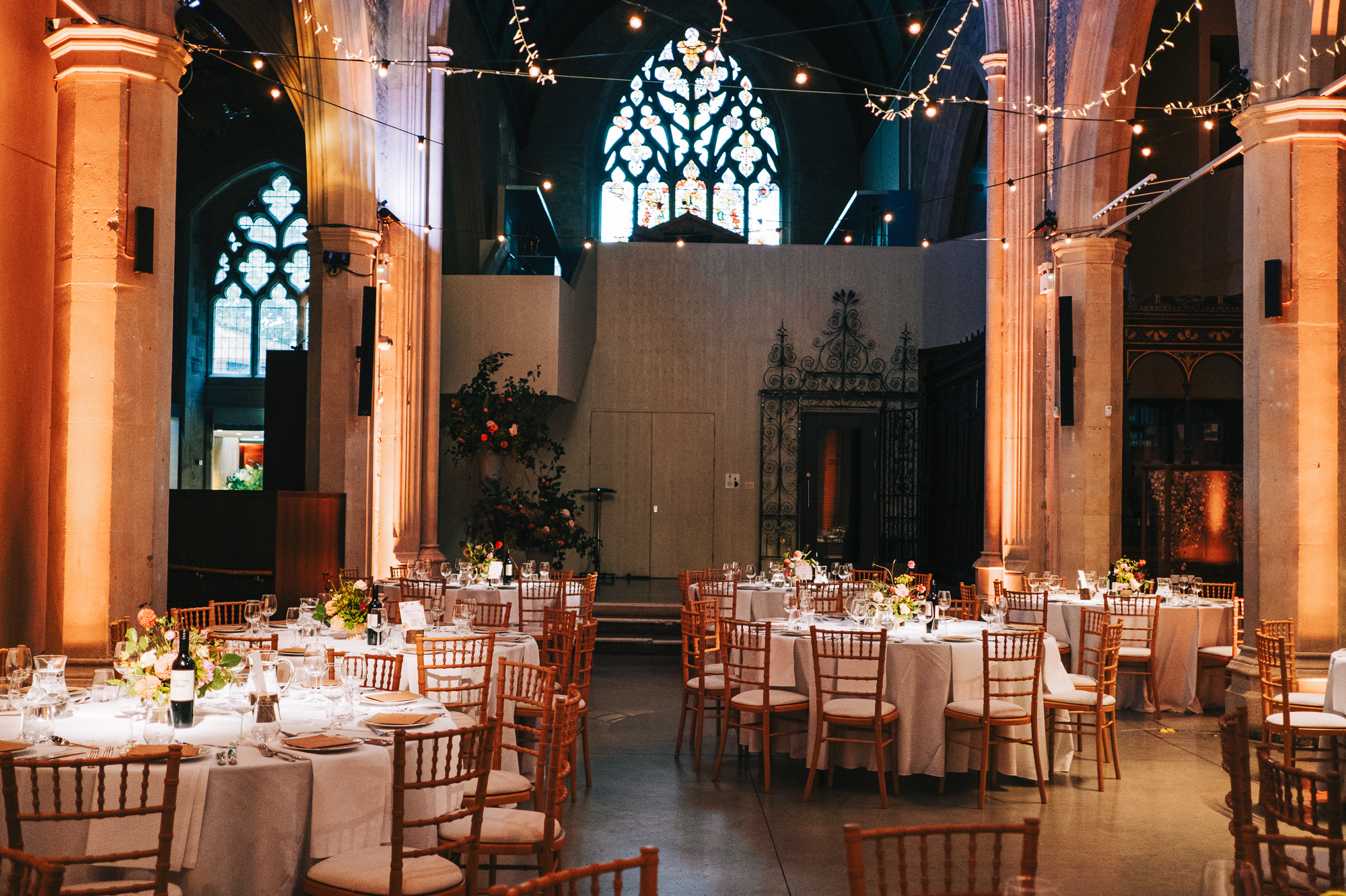 Elegant event space in Garden Museum with floral centerpieces, ideal for weddings.