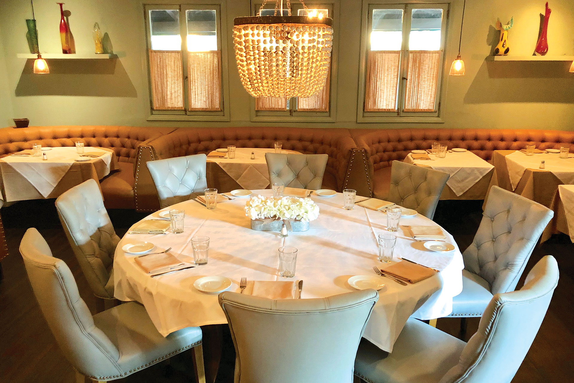 Elegant round table dining setup for private events at Ca' Del Sole, Ristorante Italiano.