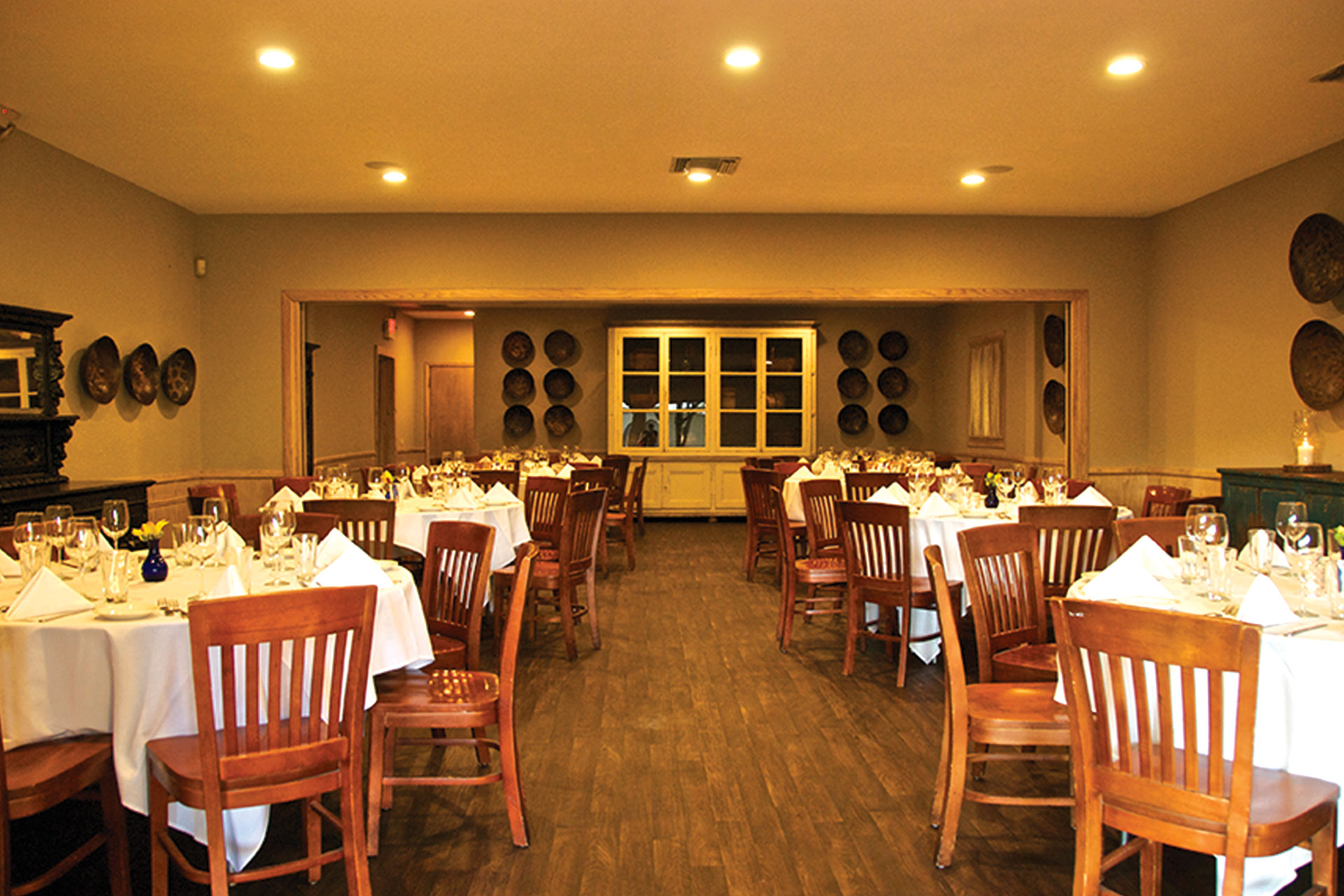 Private dining room with elegant tables for intimate gatherings and corporate events.