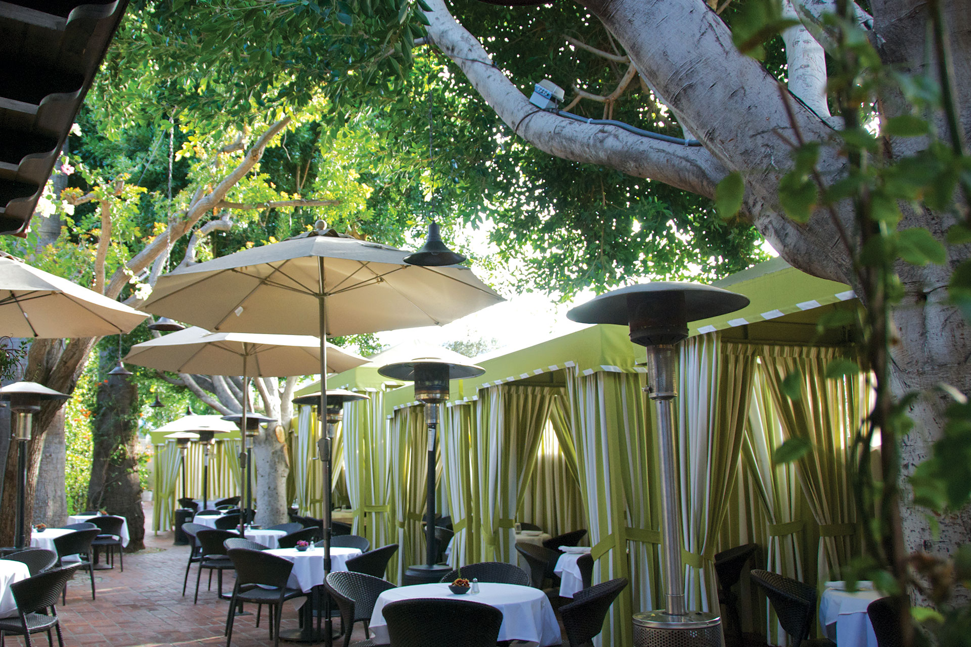 Private outdoor dining setup with elegant tables for upscale events at Ca' Del Sole.