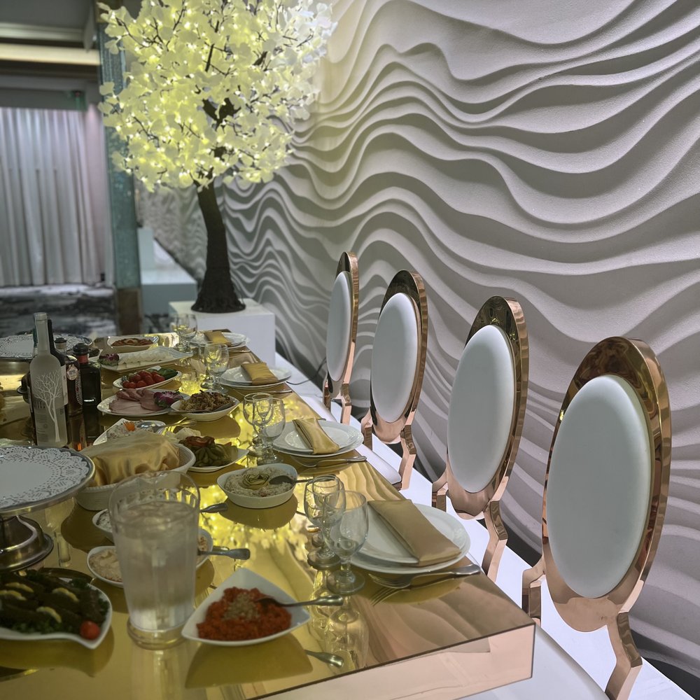 Elegant banquet hall at Victorio's Ristorante with gold accents, ideal for upscale events.