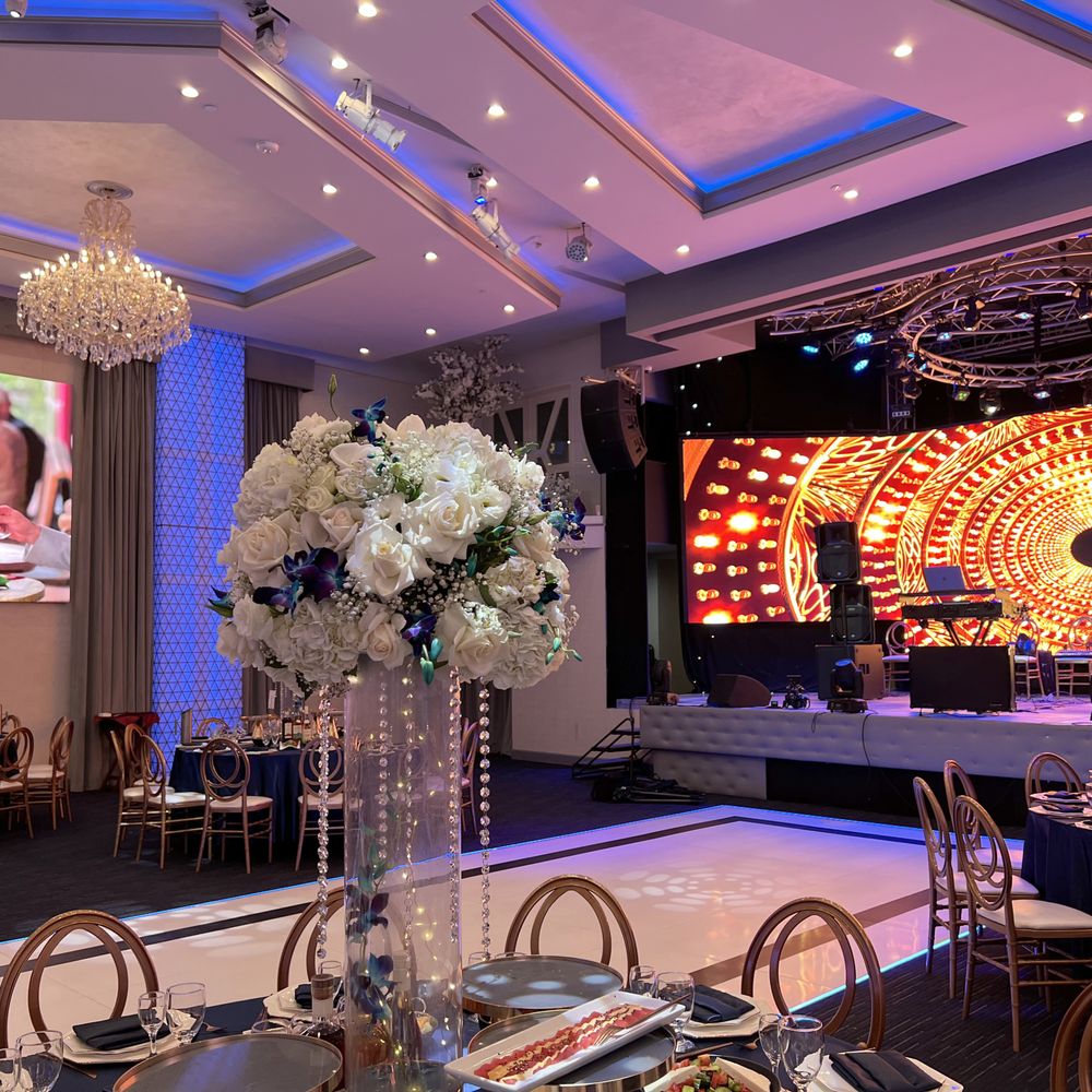 Elegant banquet hall at Victorio's Ristorante with floral centerpiece for weddings and corporate events.