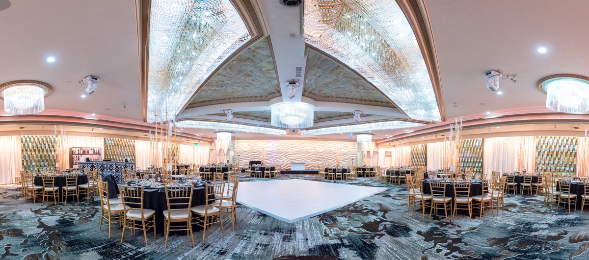 Grand Ballroom at Mirage Venue with elegant round tables, perfect for weddings and galas.