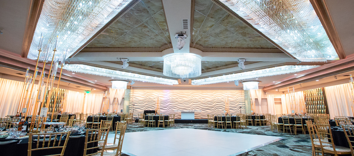 Grand Ballroom at Mirage Venue with elegant chandeliers, perfect for weddings and corporate events.