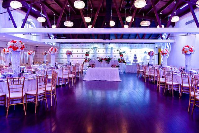 Elegant reception hall with floral decor, ideal for weddings and formal events.