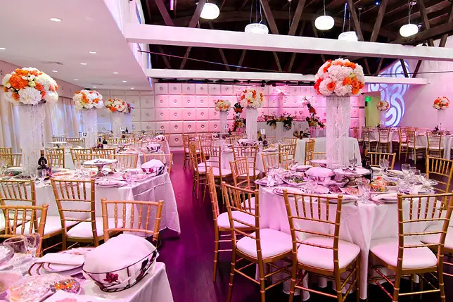 Elegant banquet hall with white linens, ideal for weddings and formal events.