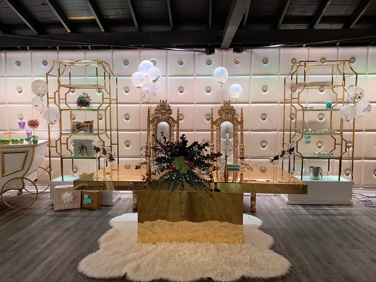 Elegant Mirage Conference Room with gold table, ideal for upscale events and celebrations.