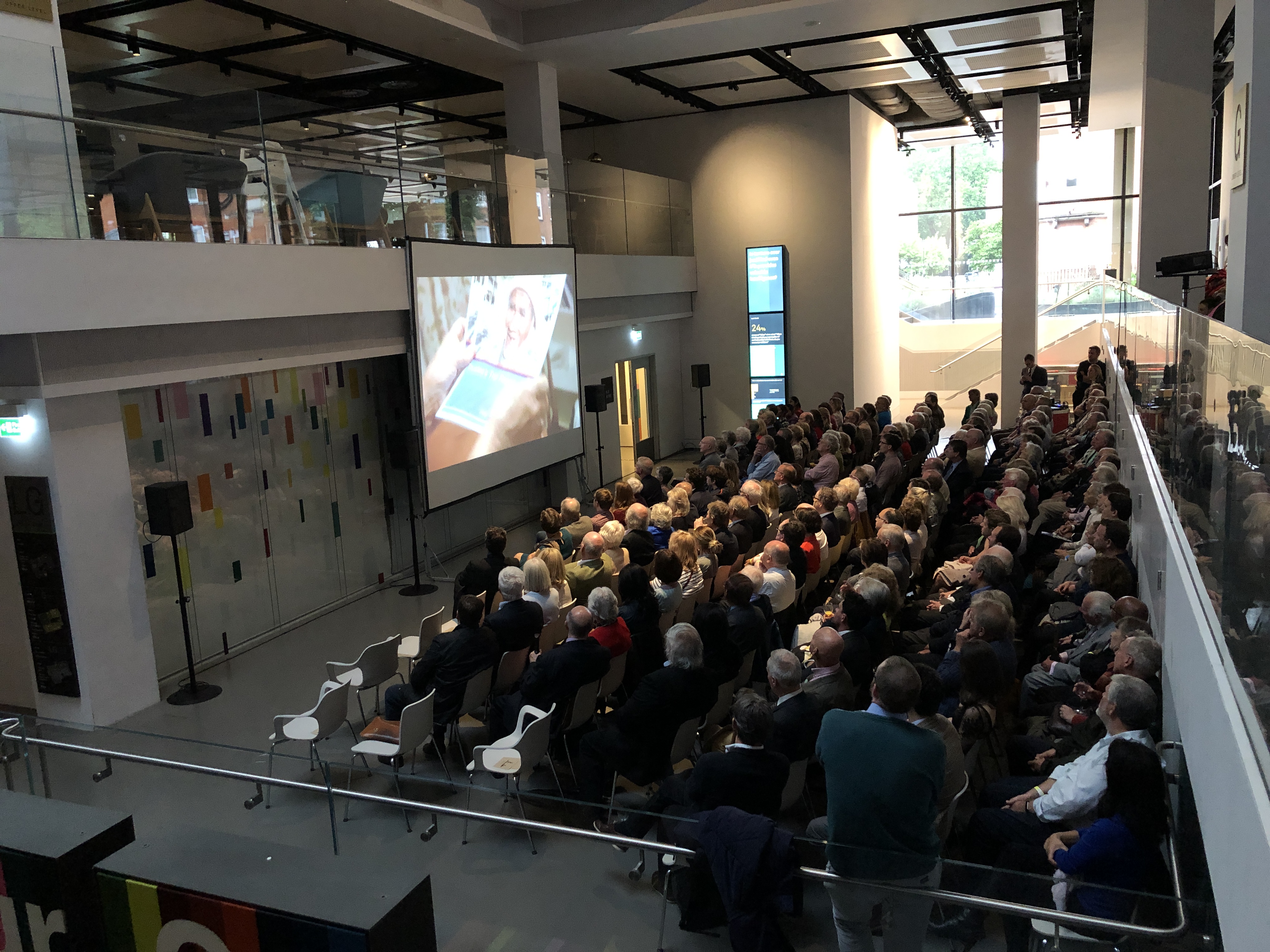 Atrium at National Army Museum event with engaged audience and modern presentation setup.