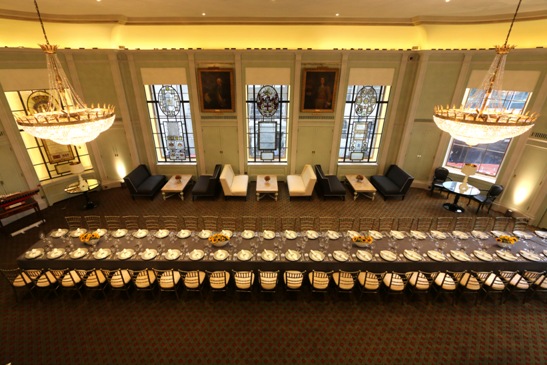 Elegant gala banquet dinner at Trinity House Library with symmetrical lounge clusters for events.