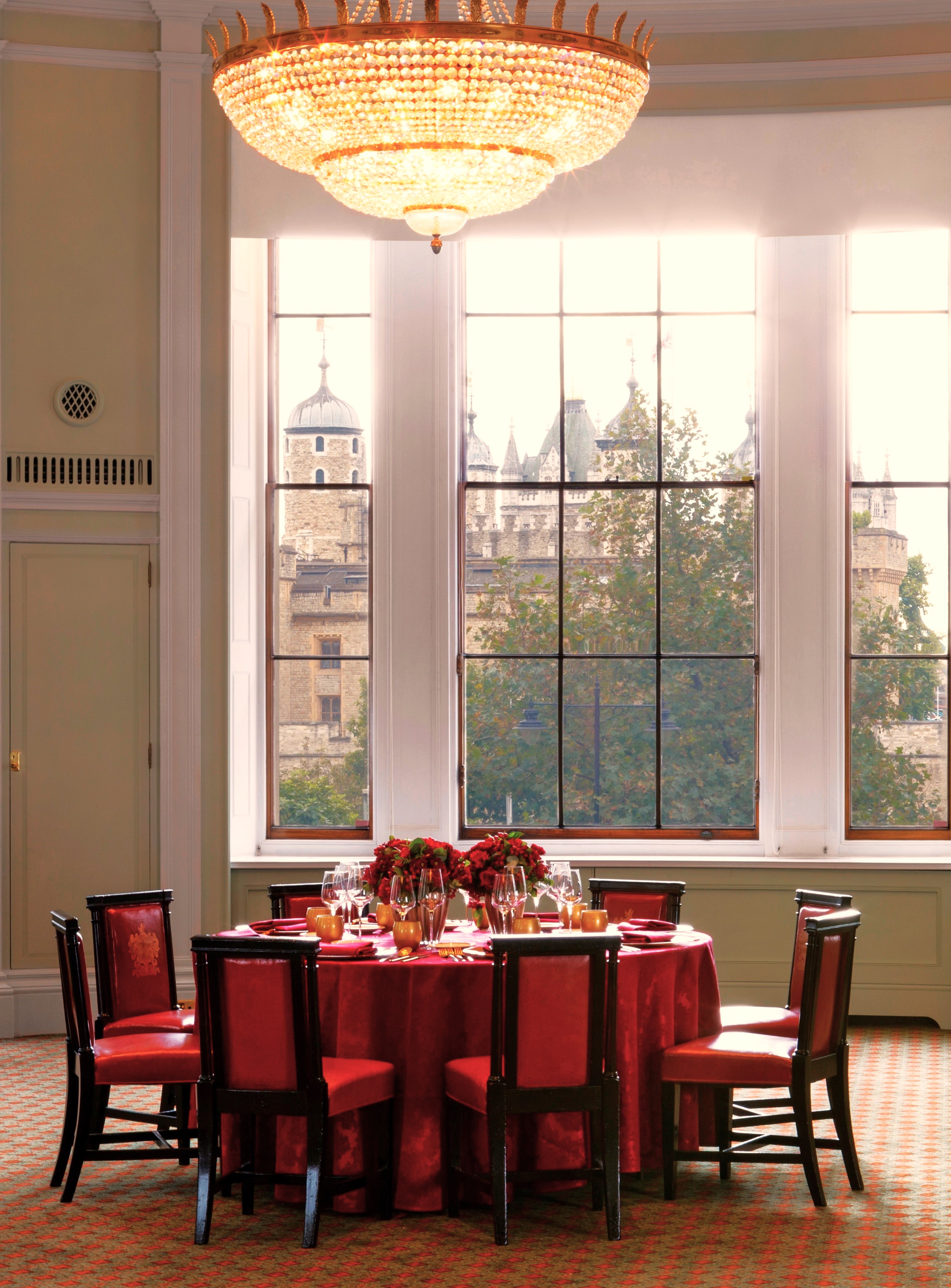 Elegant dining table in Trinity House Library with castle view, perfect for events.