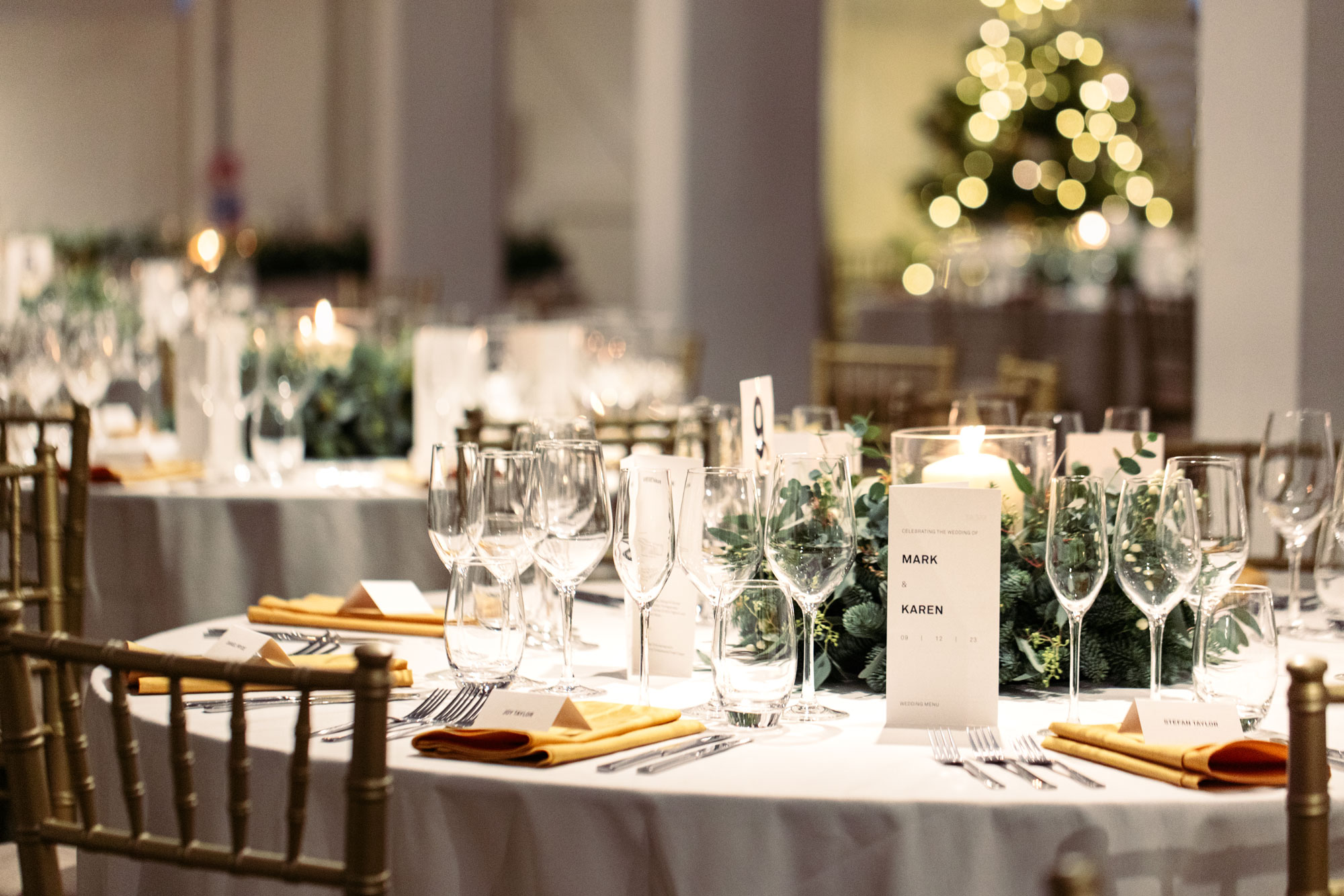 Elegant banquet table with white linens for formal events and holiday gatherings.