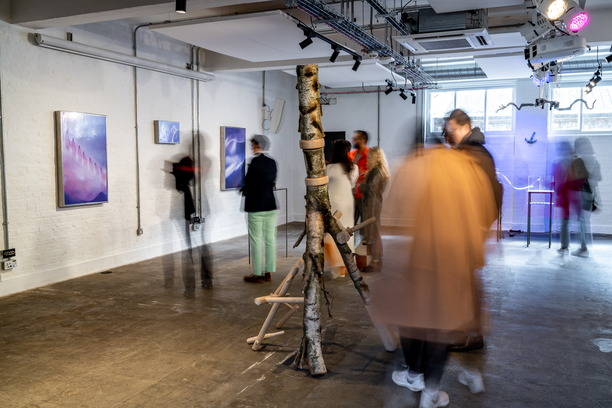 Dynamic art exhibition space with unique installations for networking events.