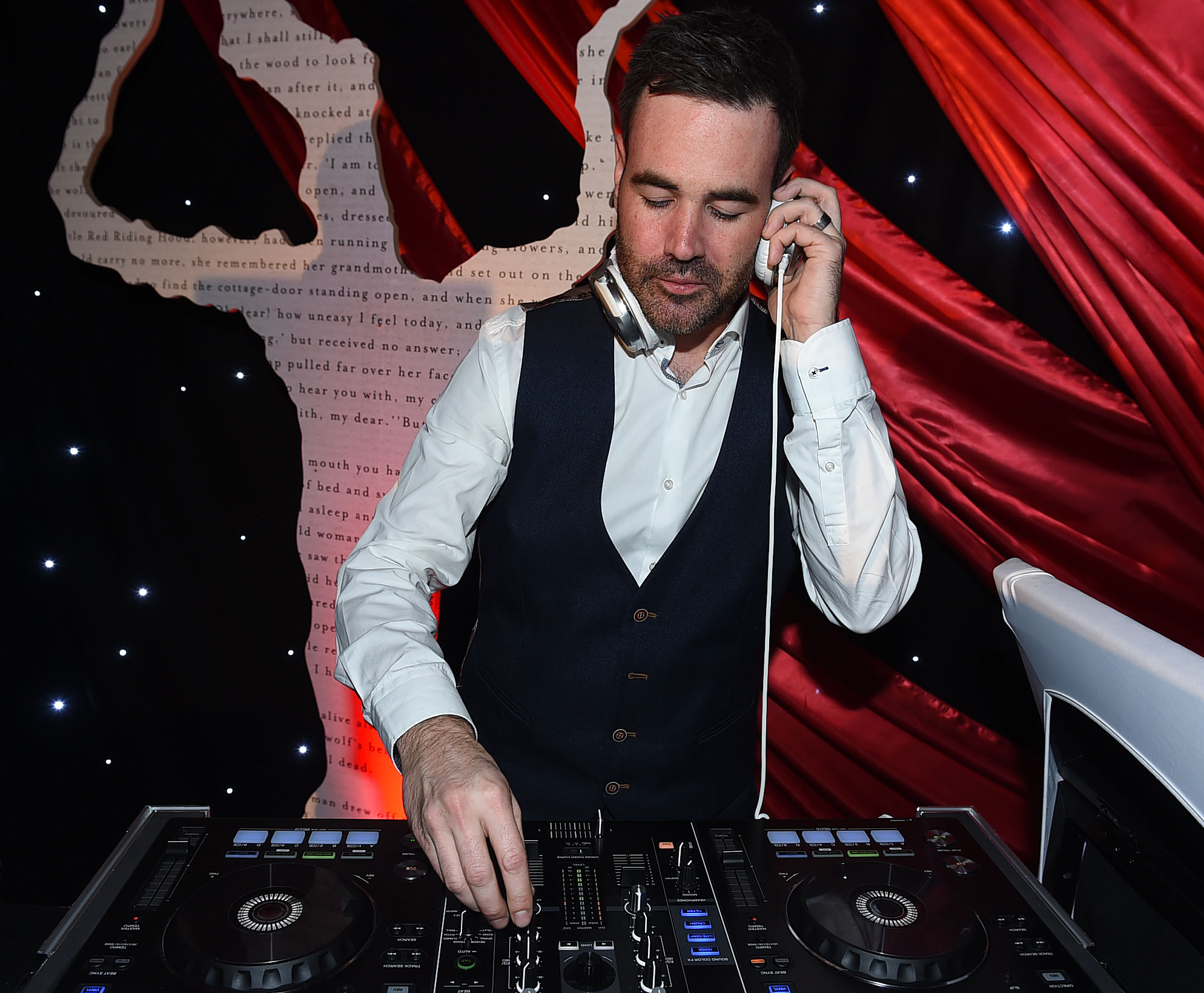 DJ at Arsenal's Emirates Stadium for a festive Christmas event atmosphere.