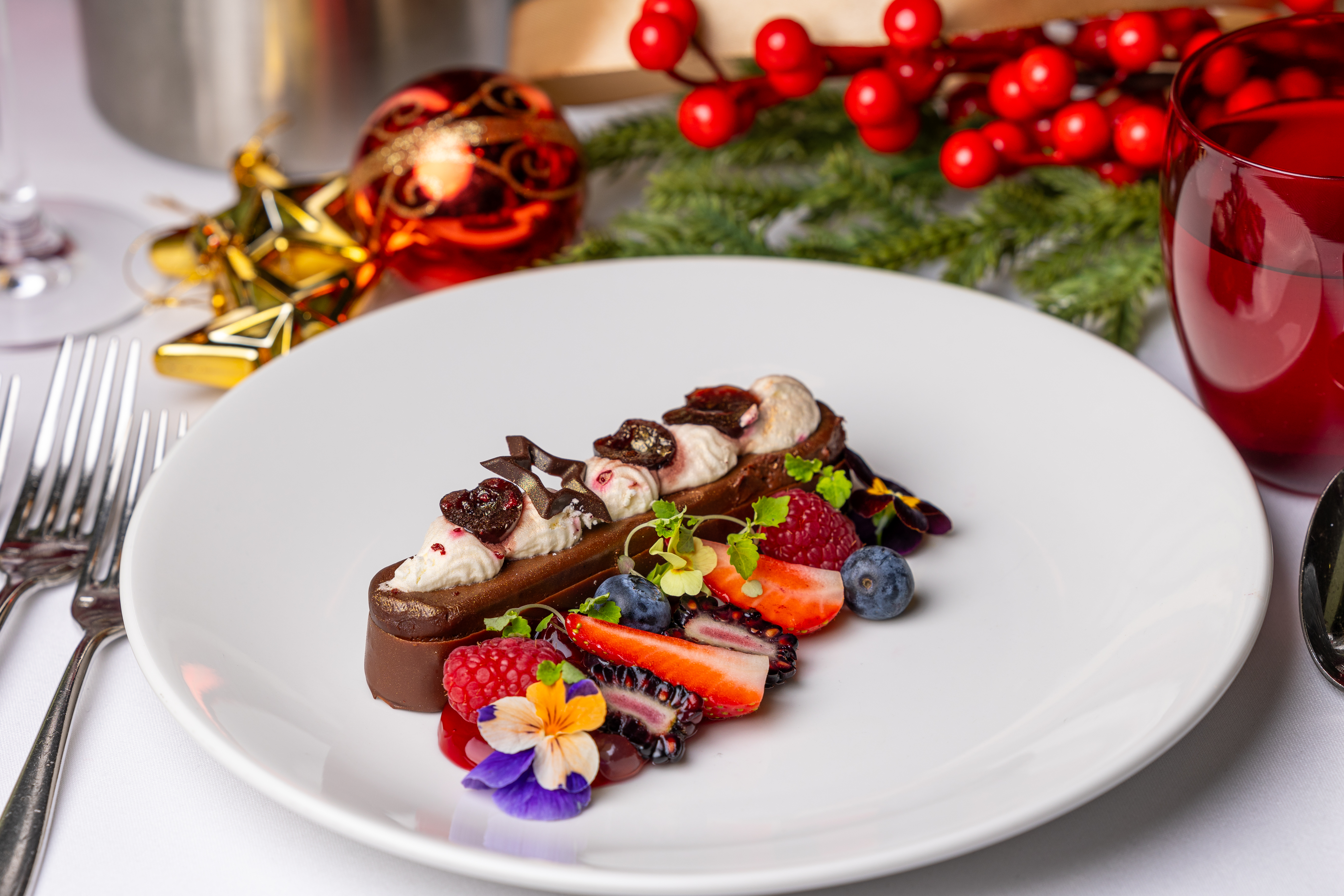 Elegant dessert with berries at Christmas event in Arsenal's Emirates Stadium.