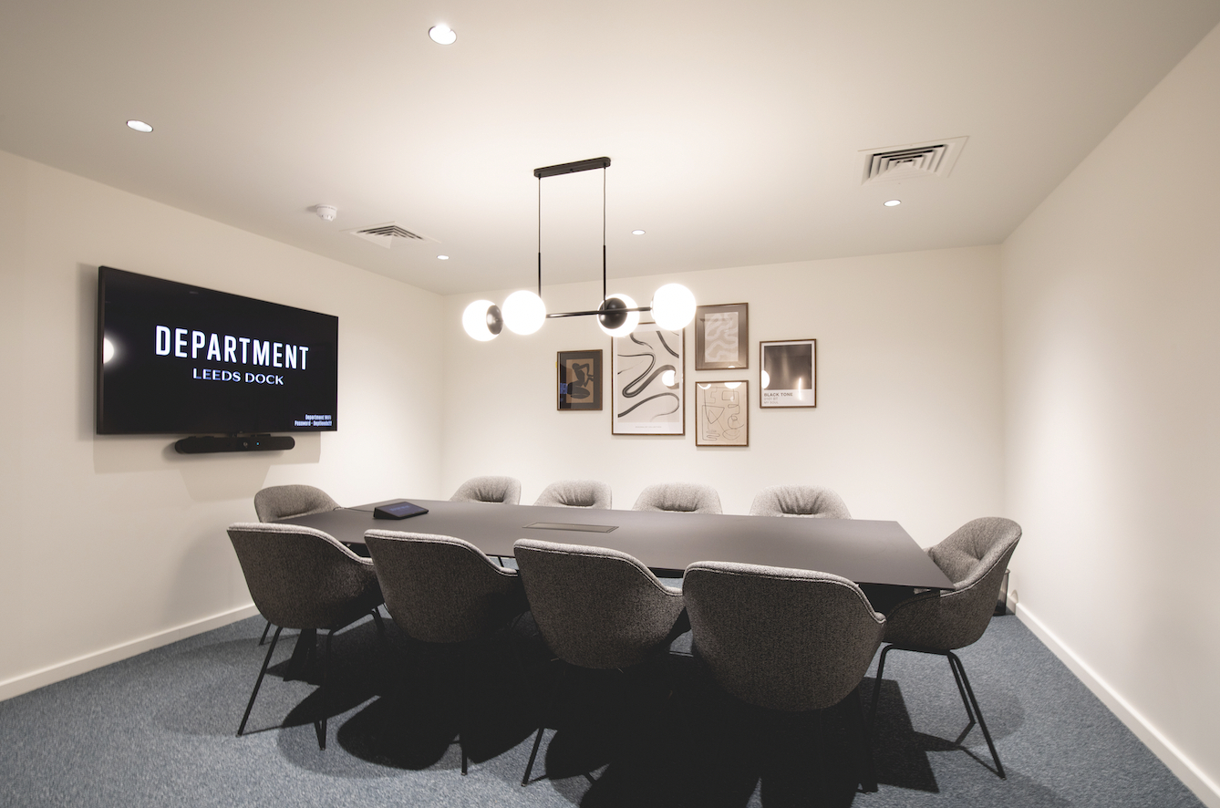 Modern meeting room in The Manor Leeds with sleek table, ideal for presentations and collaboration.