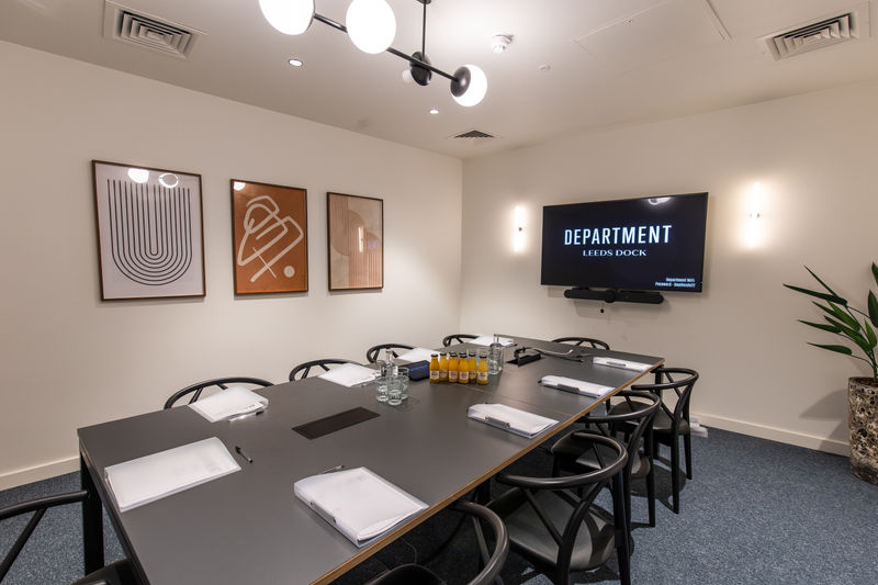Modern meeting room in The Manor Leeds, featuring a sleek table for collaborative events.