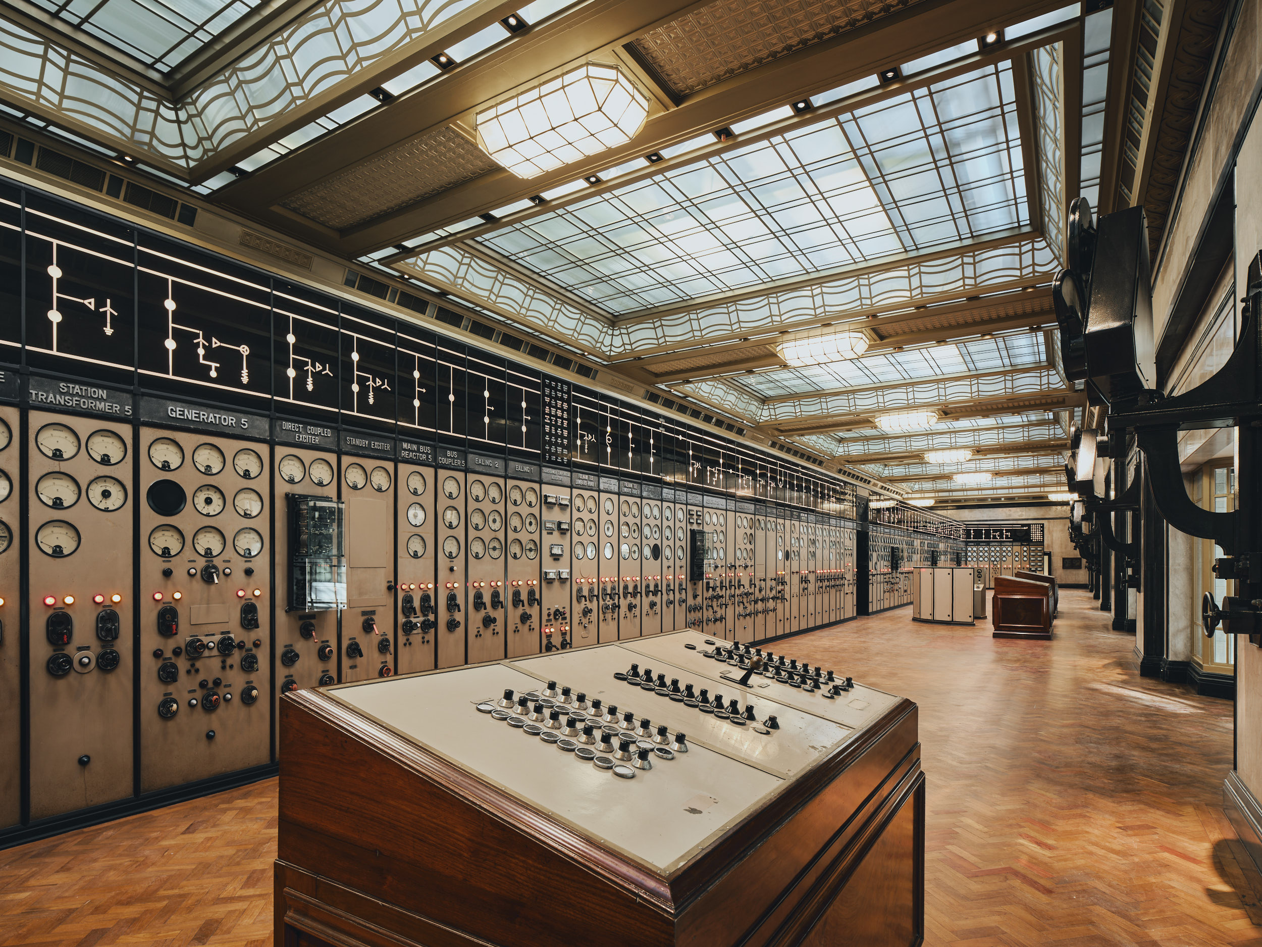 Historic Battersea Power Station control room with vintage panels, ideal for corporate events.